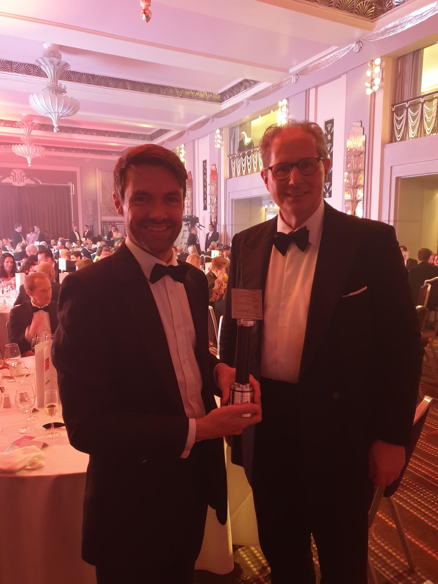 Grant Wilson and Chris Curtis holding ARC's 2023 eprivateclient Excellence Award